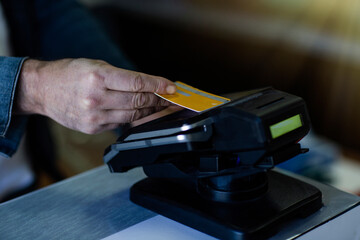 Close up of a credit card being inserted into a payment terminal
