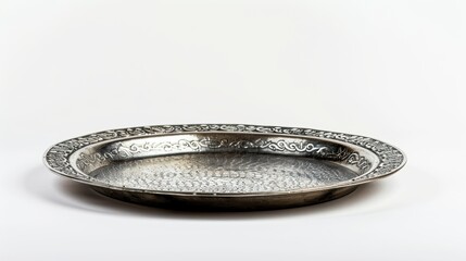Round metal tray embossed with floral design on white background
