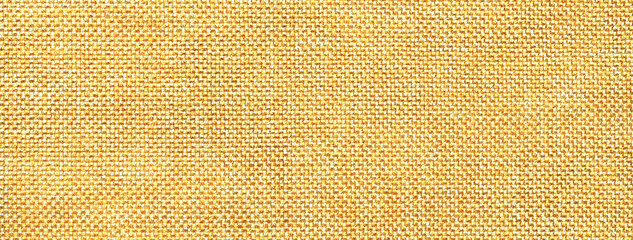 Texture yellow background from woven textile material with wicker pattern, macro. Golden vintage...