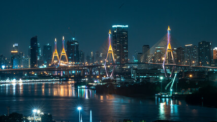 Fototapeta premium Bhumibol Bridge 1 and 2 with beautiful light up at night scene, Bangkok Thailand