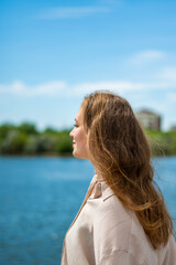 Woman enjoing sun in a park. Summer vocation concept. High quality photo.
