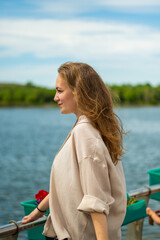 Fototapeta premium Woman enjoing sun in a park. Summer vocation concept. High quality photo.