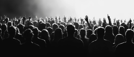 A vibrant crowd with hands raised, immersed in the festival atmosphere, celebrating music and unity.