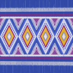 Ikat seamless pattern in tribal, folk embroidery, Mexican style. Aztec geometric art ornament print.Design for carpet, clothing, wrapping, fabric, wallpaper and decoration.