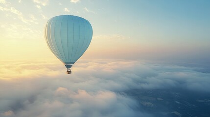 Fototapeta premium A light blue hot air balloon floating peacefully in the sky at sunrise