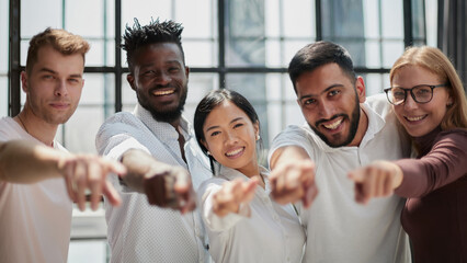 Portrait of successful creative business team looking at camera and smiling. Diverse business people standing together at startup.