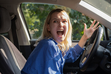 Stressed woman drive car feeling sad and shocked. Caucasian blond girl shouting and feeling frustrated.