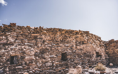 Remains of the ancient fortress of Yamchun in the Tien Shan mountains in Tajikistan in the Pamirs, ruins of a fortress fort made of stone on the background of mountains