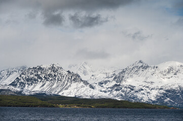 snowy landscape with snow-covered mountains along the road from Alta to Tromsoe, Norway