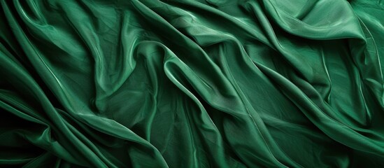 Fototapeta premium Green fabric backdrop with available copy space image.