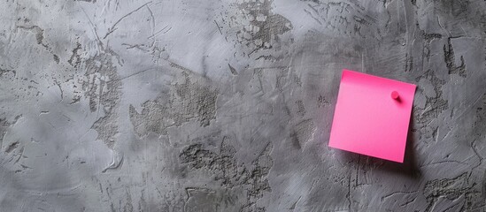 Pink sticky note with 'Build New skills' concept word on a lovely grey background for a business theme with ample copy space image.