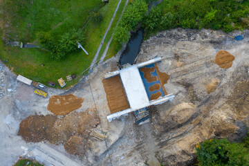 A new bridge across a small river. Summer time. Small reinforced concrete bridge after...