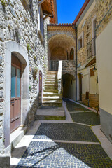 A narrow street between the old houses of Scapoli in Molise, Italy.