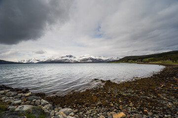 snowy landscape with snow-covered mountains along the road from Alta to Tromsoe, Norway