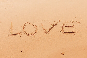 The inscription I love you on the seashore with palm trees