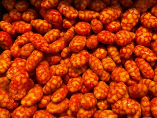 Orange hard candies made from nuts