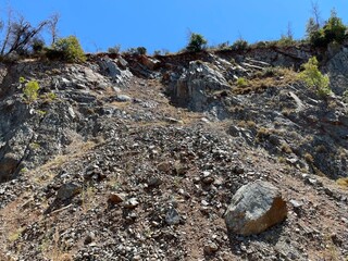 Falling rocks from the mountain. Rockfall. Mountains in Greece.