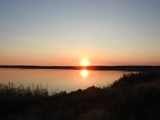 You get a peaceful feeling as the sun sets over the wetland marsh within the Edwin B. Forsythe...