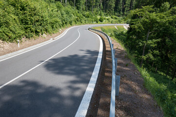 Road with asphalt coating. Heavy and light vehicle movement a road among the mountains. Paved road...