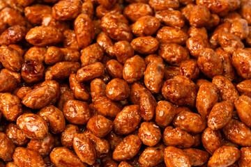Tasty sweet roasted peanuts as a background.