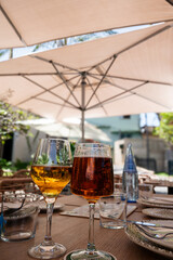Stout and lager together on the table surrounded by plates and silverware