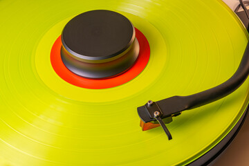 Coloured vinyl record spinning on a hifi turntable
