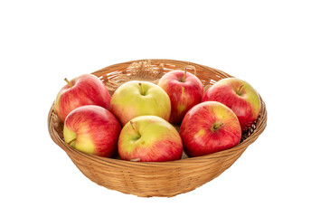 Several red apples on a straw plate, macro, isolated on a white background.