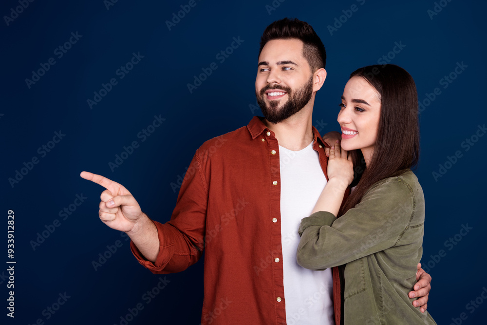 Canvas Prints Photo of cute couple wife husband wear stylish clothes recommend proposition empty space isolated on dark blue color background