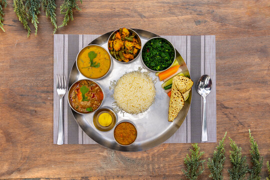 Nepali Meal of Daal Bhaat Tarkari Thakali Thali  Meat Rice vegetables and pickle dhido meal dinner or lunch