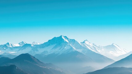 Impressive Mountain Range with Snow-Covered Peaks and Clear Sky