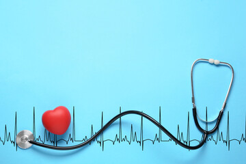 Red decorative heart, stethoscope and electrocardiogram on light blue background, top view