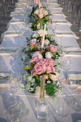 Chairs and table decorated with candles and flower. Wedding Day
