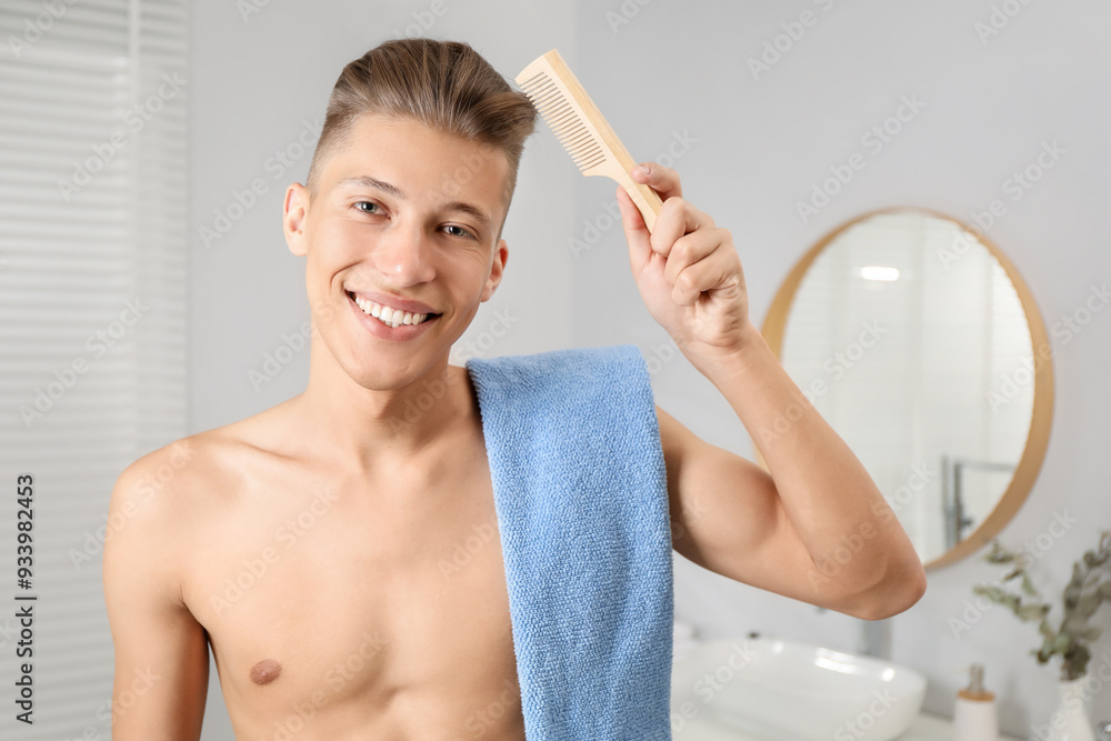 Sticker Handsome man with comb and towel in bathroom