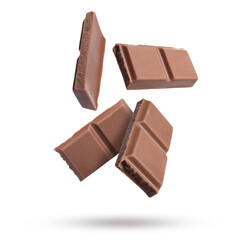 Pieces of sweet chocolate falling on white background