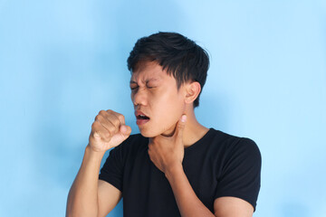 Young Asian man got sore throat and coughing