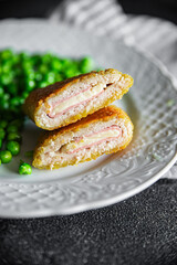 cutlet cordon bleu chicken meat, cheese, bacon meal snack on the table copy space food background rustic top view