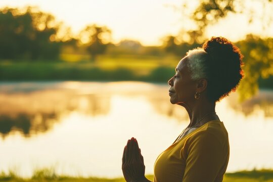 Serene Silhouette of an Elderly African American Woman Practicing Lakeside Yoga, Embracing Nature, Mindfulness, and Aging Gracefully