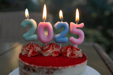 Burning Candles number 2025 on the cake. Happy New Year. festive pictures on a New Year's theme....