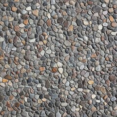 A close-up view of a textured pebble stone surface with varied colors and irregular shapes.