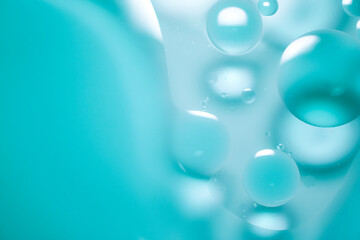 Oil drop background on blue water surface It is natural and abstract.