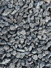 Crushed grey stone on the ground texture background