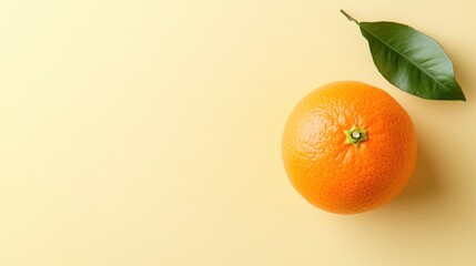 Orange and Leaf on Yellow Background