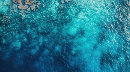 Obraz premium Crystal clear Thai sea from above, showcasing the transition from shallow to deep blue waters.
