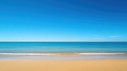 Fototapeta premium Serene Beachscape Under a Vast Blue Sky