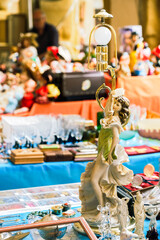 Figurine dancer as lamp on stall at the flea market Arezzo Italy