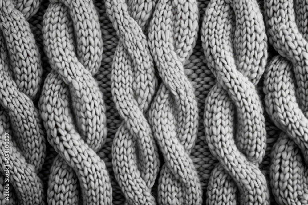 Poster close up of knitted blanket, fabric texture with knitted or woven patterns