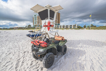Lifeguard stand with 4 wheeler  jetski at gulf of mexico