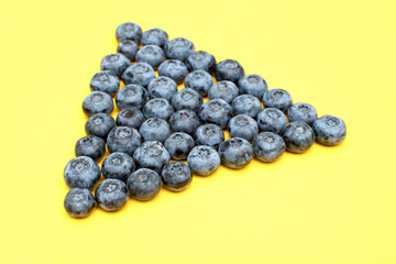 Fresh blueberry on yellow background	
