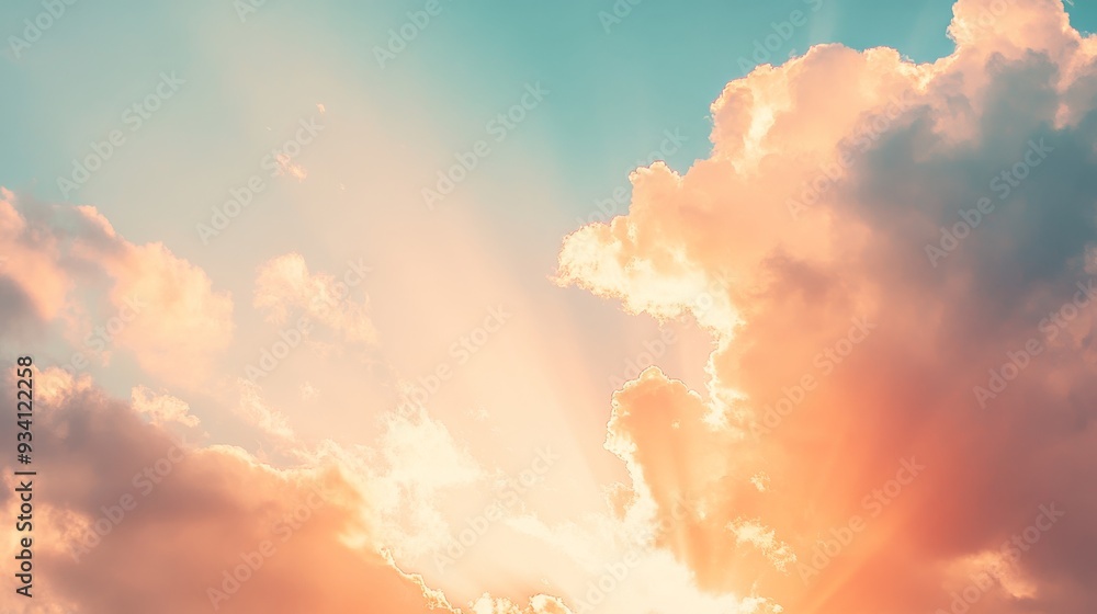 Poster sunlight bursting through scattered clouds at sunset, bathing the sky in a gradient of warm colors
