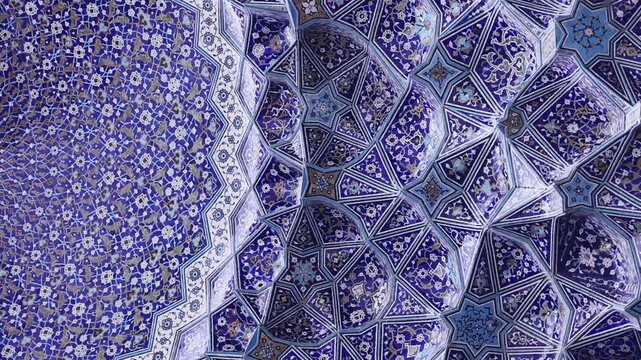 Ceiling at Imam Mosque, arch at the entrance, Naghsh-e Jahan Square, Isfahan, Iran. Beautiful oldest iranian mosque interior design. Unique mosaics and ornaments. A masterpiece of Persian architecture